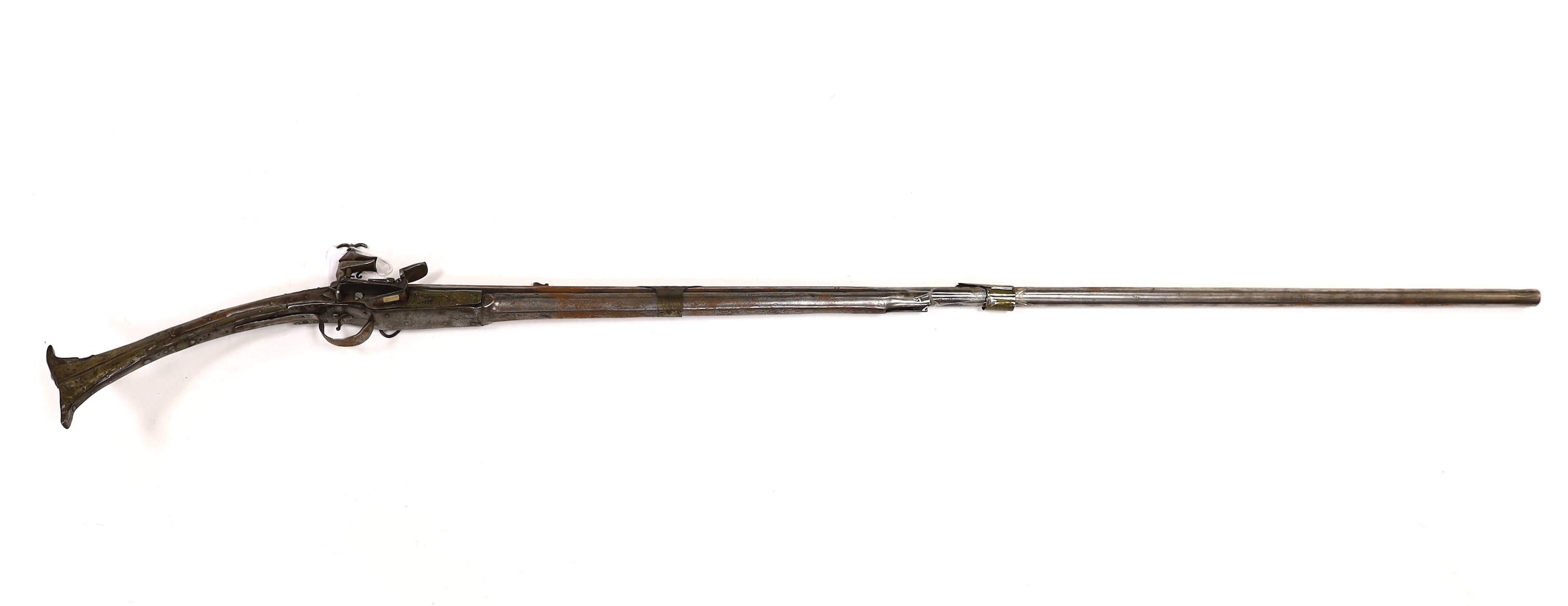 A 19th century Albanian flintlock miquelet lock rifle (Balkan long arm) and a Caucasian style dagger, with niello work scabbard, barrel 122cm (2)